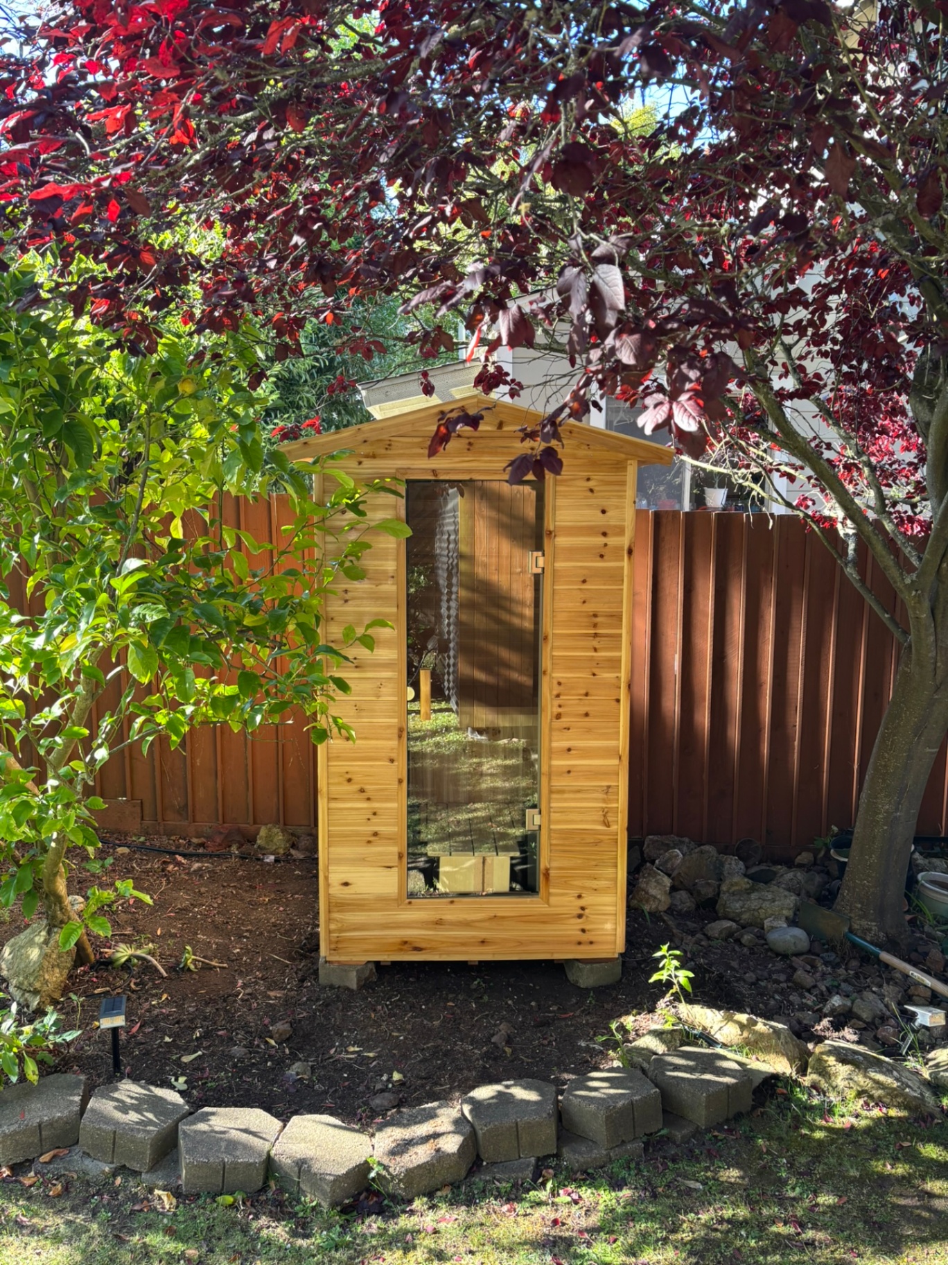 Outdoor steam sauna rental in San Francisco backyard with garden patio