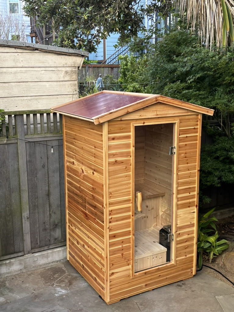 Outdoor steam sauna with copper roof in SF backyard