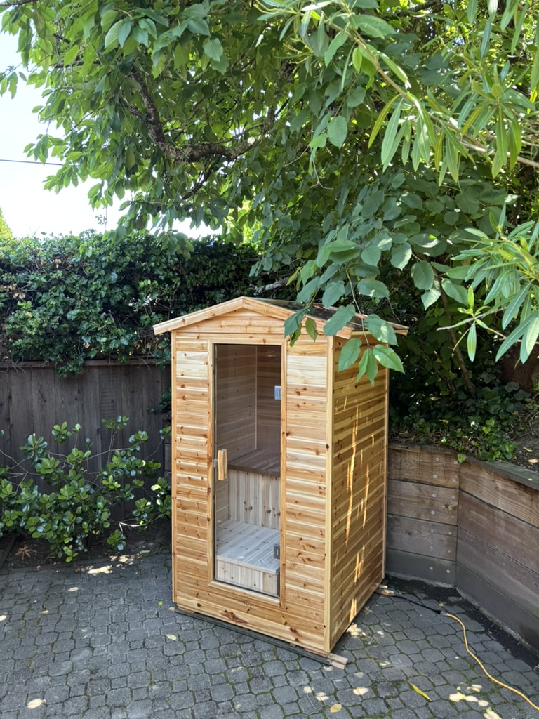 Outdoor steam sauna installed in lush Bay Area backyard