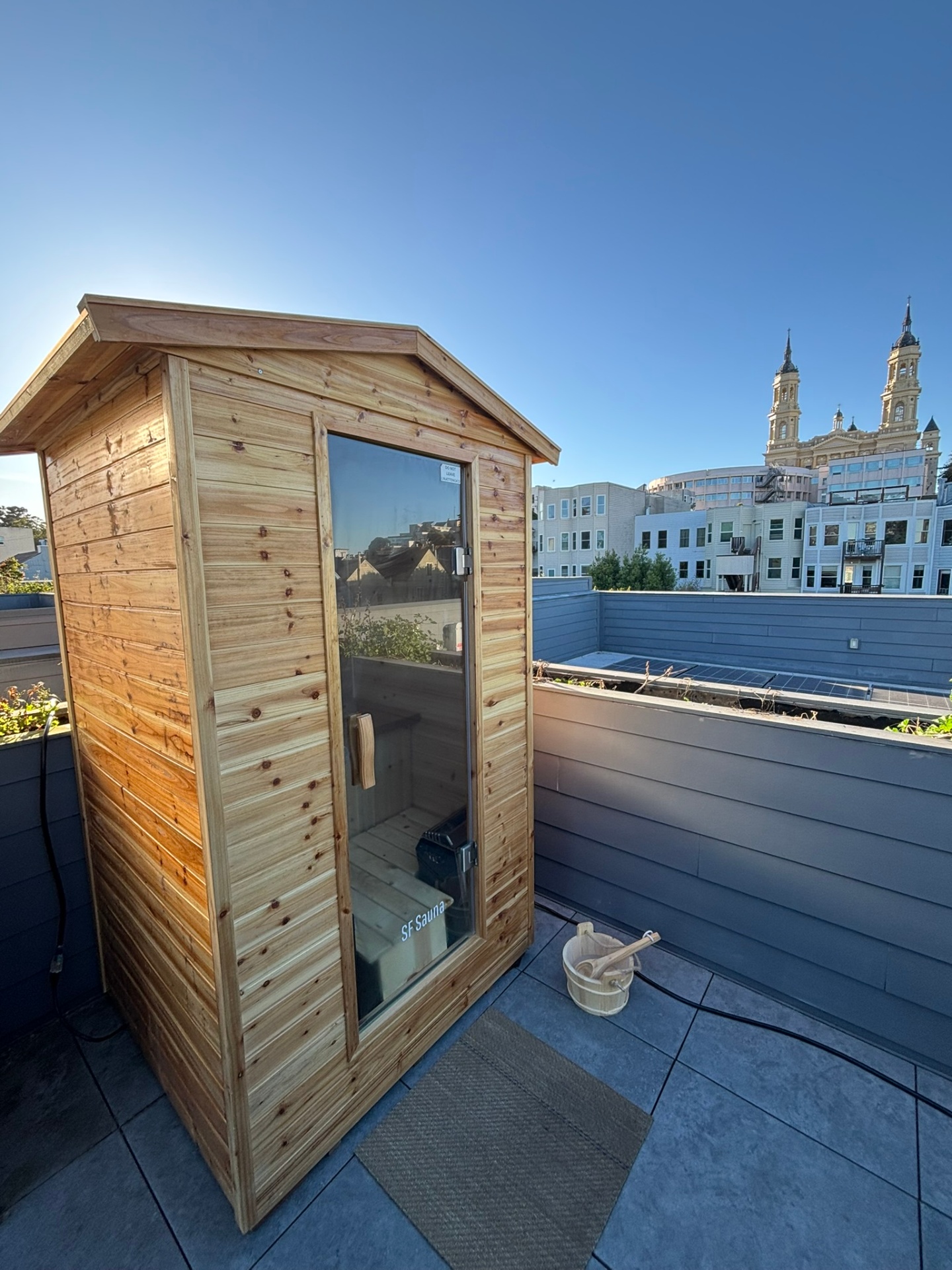 Rooftop outdoor steam sauna with San Francisco skyline view