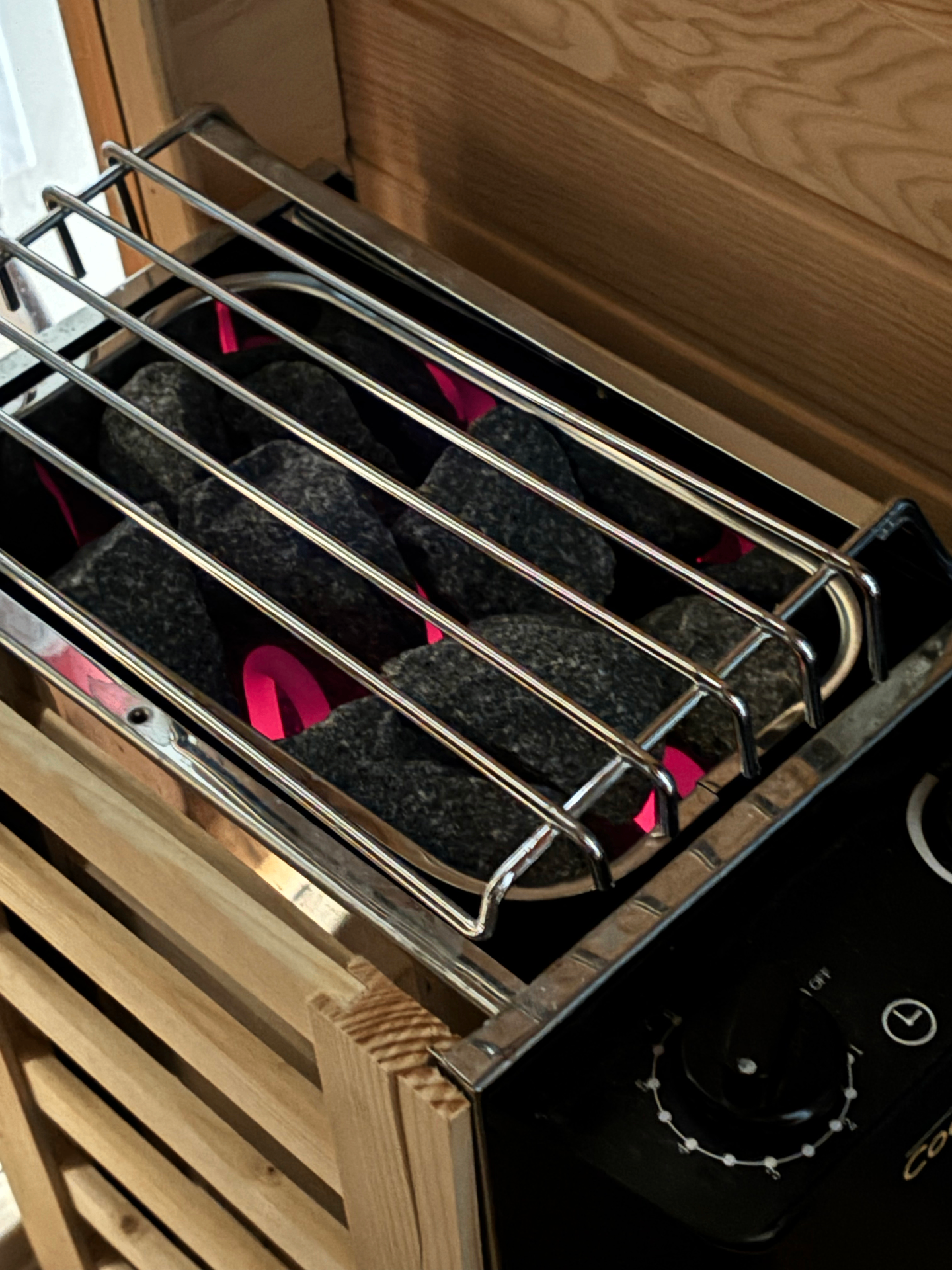 Finnish dry sauna heater with hot rocks in SF home rental