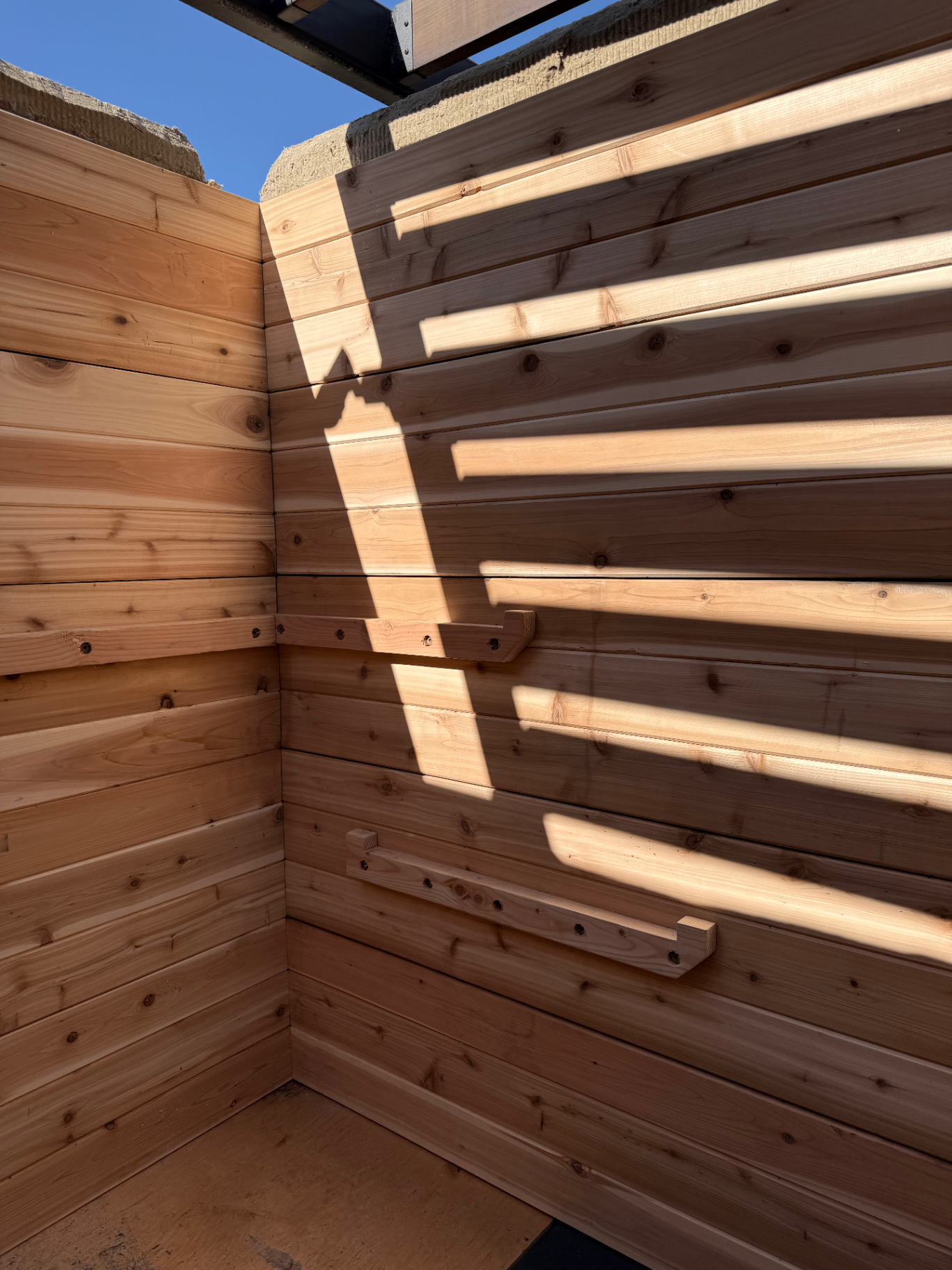 Interior cedar wall detail of sauna installation