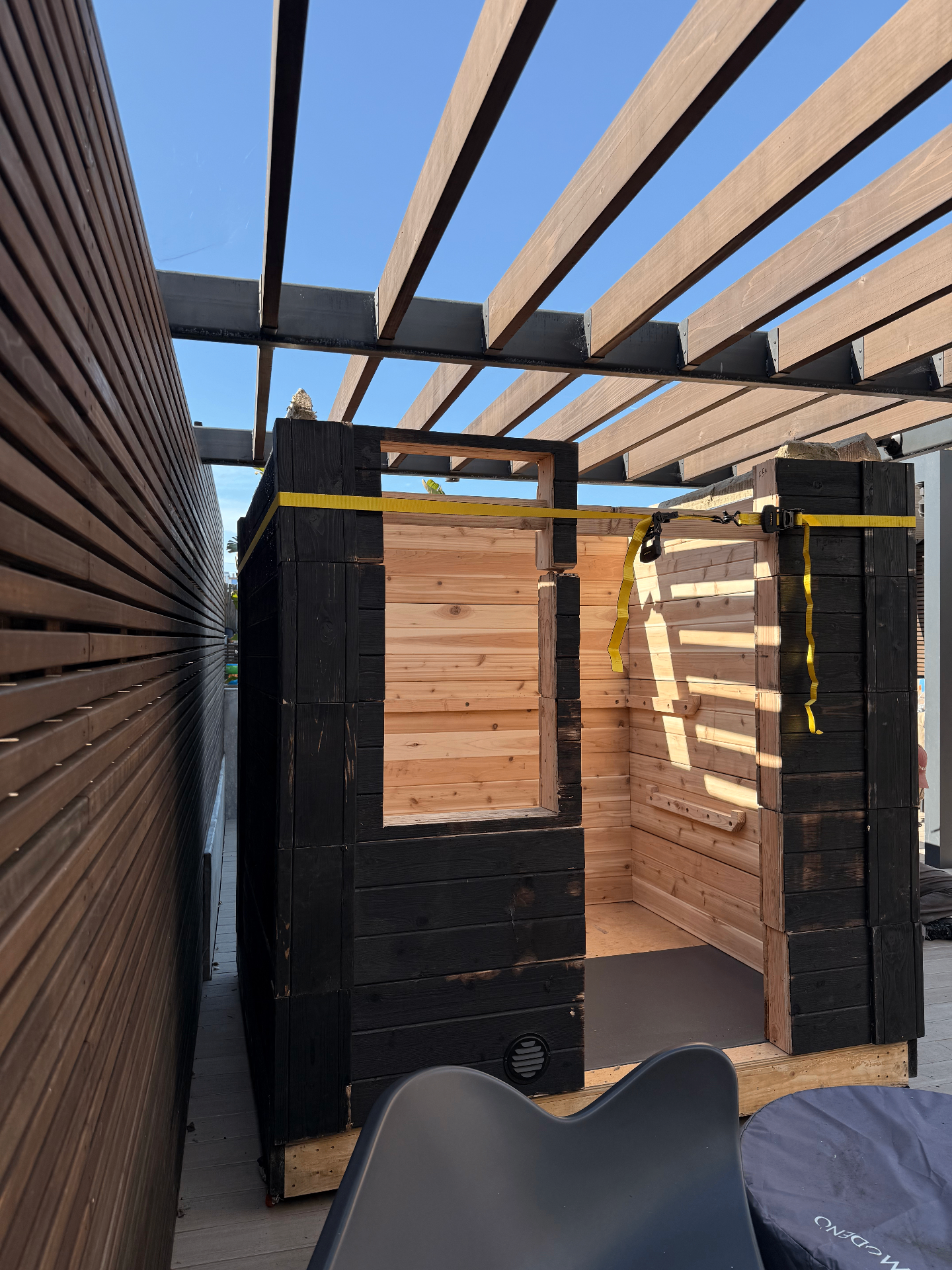 Prefab sauna being assembled on Bay Area patio